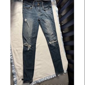 A&E dark washed distressed jegging size 4